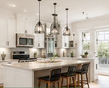 Remodeled white kitchen with island seating